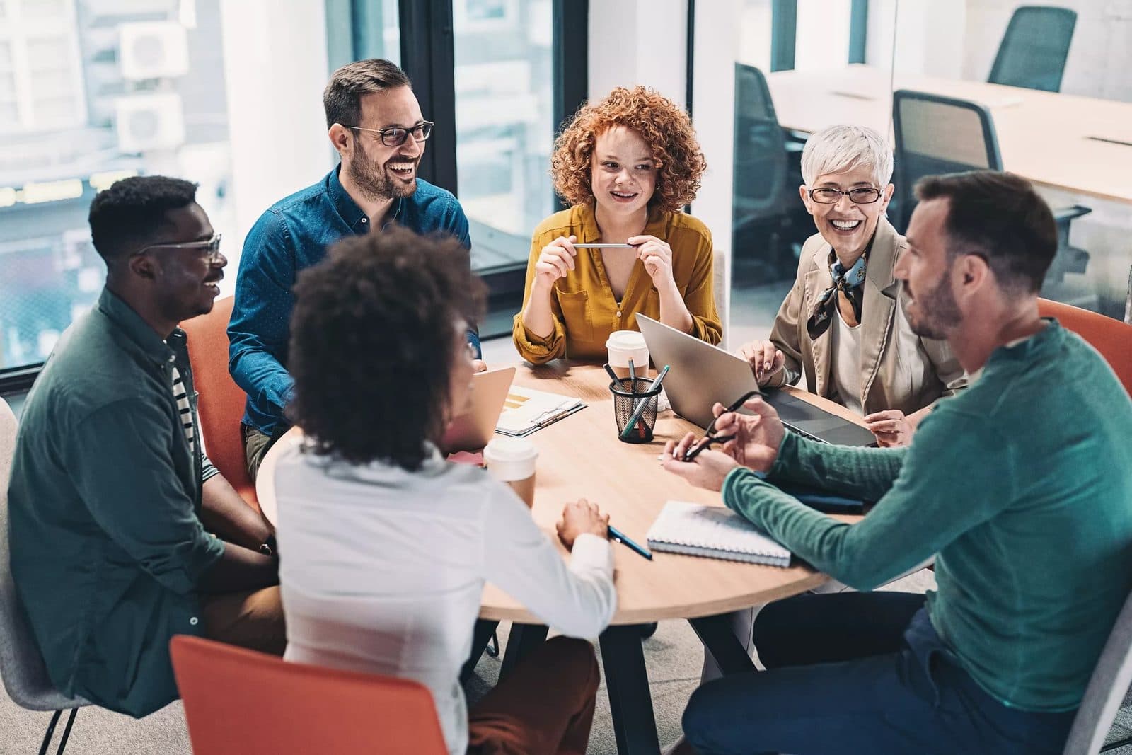 i-Offshore team collaborating in a modern office